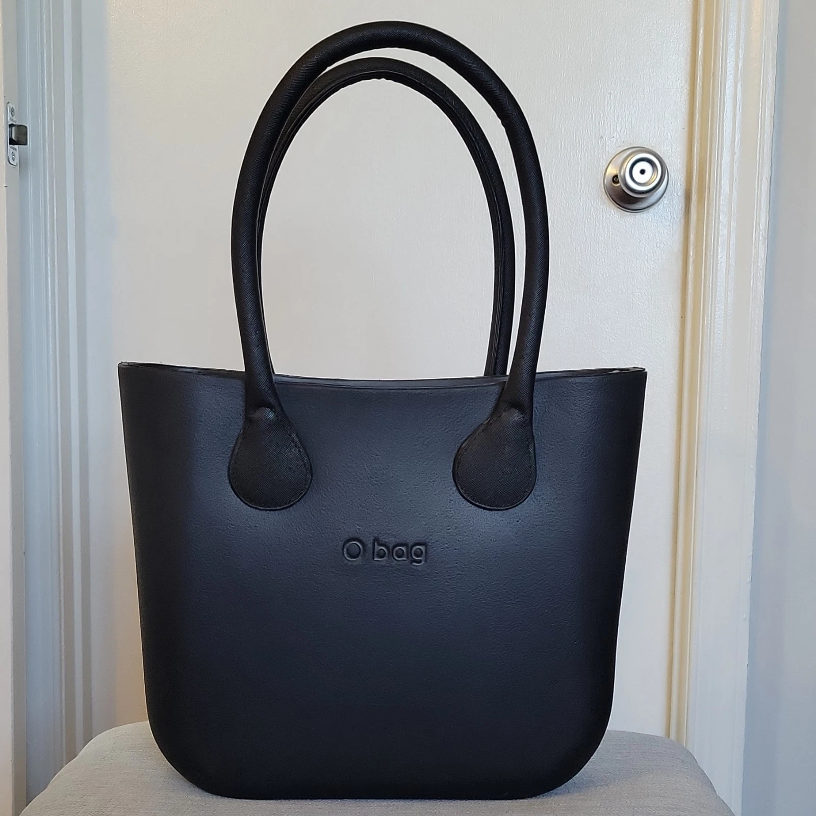 O bag, black tote, zip closure, floral lining, double handles, designer - O Bag